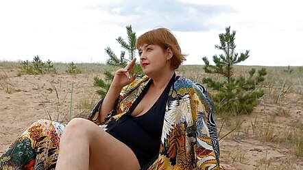 Mistress Lola smoking outside and ignoring you